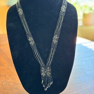 Beautiful iridescent 16” beaded necklace with very vintage feel.